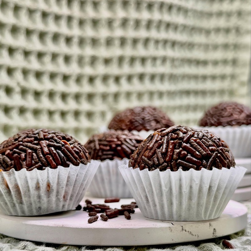 Chocolate brigadeiros rolled in chocolate sprinkles
