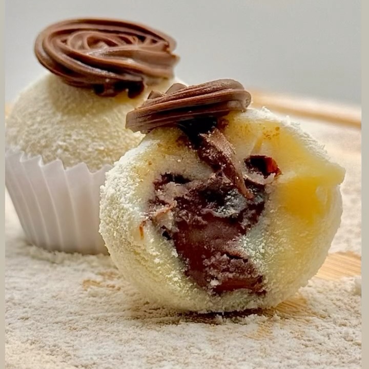 Milk brigadeiro cut open to show its Nutella center